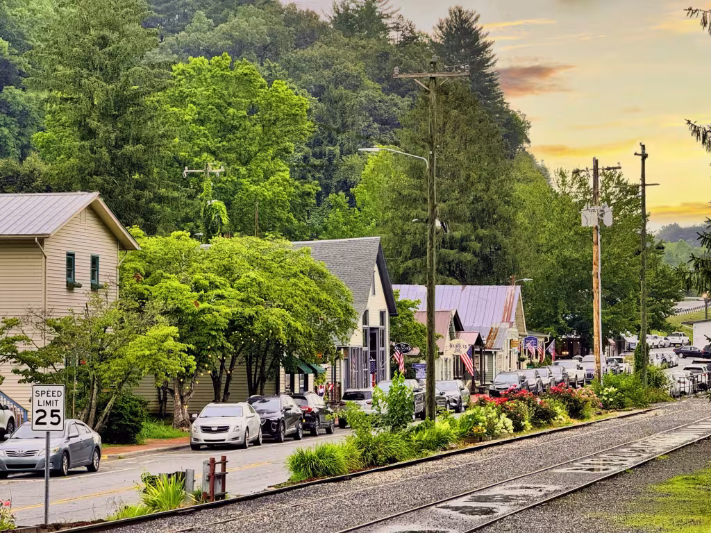 Front Street in Dillsboro: painted shopfronts and trees beside the railroad track