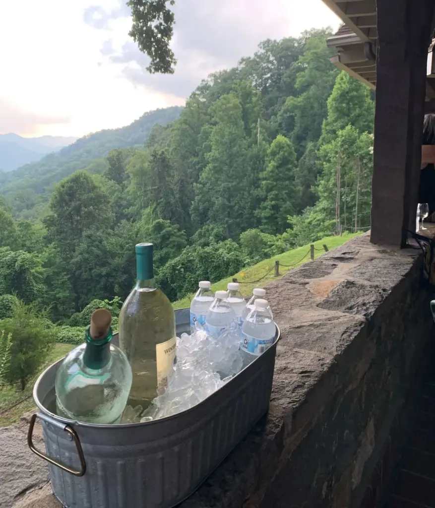 Wine on the patio ledge, mountains beyond