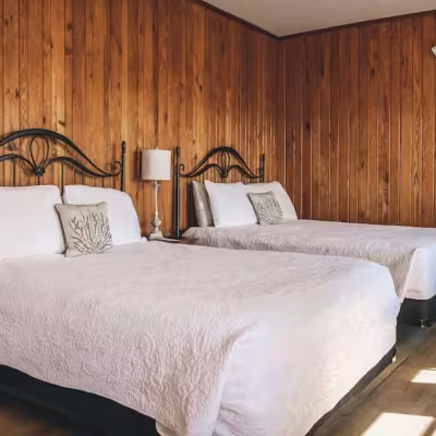 Two queen beds in the Violet Room